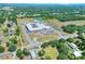 School overview from an aerial view surrounded by greenery, near a neighborhood at 140 Heritage Park Ln, Mulberry, FL 33860