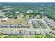 Scenic aerial view of a lovely neighborhood, surrounded by lush greenery at 140 Heritage Park Ln, Mulberry, FL 33860