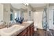 Bathroom featuring dual sinks, granite counters, and a shower/tub combination at 140 Heritage Park Ln, Mulberry, FL 33860