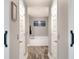 Bathroom featuring a soaking tub, wood-look flooring and wall art at 140 Heritage Park Ln, Mulberry, FL 33860