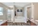 Bathroom with a soaking tub, glass shower, and wood-look flooring at 140 Heritage Park Ln, Mulberry, FL 33860