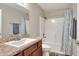 Bathroom features a shower-tub combination with tile surround, single sink vanity and modern fixtures at 140 Heritage Park Ln, Mulberry, FL 33860