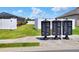 Neighborhood mailboxes and well-maintained landscaping add curb appeal and convenience at 140 Heritage Park Ln, Mulberry, FL 33860