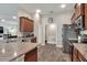 Kitchen with granite counters, stainless steel appliances, and a view into the living room at 140 Heritage Park Ln, Mulberry, FL 33860