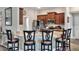 Kitchen featuring granite countertops, stainless steel appliances, and custom cabinetry at 140 Heritage Park Ln, Mulberry, FL 33860