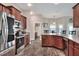 Kitchen with a view of the bathroom, dining room and stainless steel appliances at 140 Heritage Park Ln, Mulberry, FL 33860