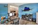 Home office with wood floors, large fish decor and a view into the adjacent living room at 140 Heritage Park Ln, Mulberry, FL 33860