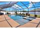 Sparkling pool enclosed by a screen, complete with a spa and meticulously maintained landscaping at 140 Heritage Park Ln, Mulberry, FL 33860