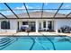 Inviting screened-in pool and lanai offers a relaxing outdoor living space with ample seating and entertainment options at 140 Heritage Park Ln, Mulberry, FL 33860