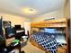 Bedroom featuring a wood bunk bed and visible clutter, with a closet at 1618 Crystalview Trl, Lakeland, FL 33801