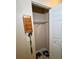 Small closet with hanging rack and wire shelf, with shoes on the floor at 1618 Crystalview Trl, Lakeland, FL 33801