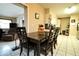 Eat-in dining area features a dark wood table with seating for four, and bright white tiled floors at 1618 Crystalview Trl, Lakeland, FL 33801