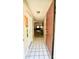 Inviting foyer with tile flooring and a view into the living spaces at 1618 Crystalview Trl, Lakeland, FL 33801