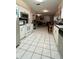 Bright kitchen with white cabinets and tile flooring, offering ample space at 1618 Crystalview Trl, Lakeland, FL 33801