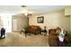 Comfortable living room with neutral carpeting and a cozy atmosphere at 1618 Crystalview Trl, Lakeland, FL 33801