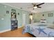 Comfortable bedroom with decorative nautical-themed bedding and a ceiling fan at 202 Saint Lucie Rd, Winter Haven, FL 33884
