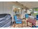 Inviting covered patio with comfortable seating, perfect for outdoor relaxation and entertaining at 202 Saint Lucie Rd, Winter Haven, FL 33884
