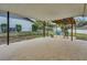 View of the covered patio with an additional pergola and outdoor seating area at 202 Saint Lucie Rd, Winter Haven, FL 33884