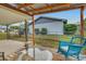 View of the backyard with a wood deck, outdoor seating, and a metal fence at 202 Saint Lucie Rd, Winter Haven, FL 33884