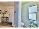 Conveniently located half-bath with a frosted window for privacy, adjacent to the home's entry at 6286 Manitoba Dr, Lakeland, FL 33805