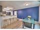 Bright dining area featuring a blue accent wall and a table with seating for Gathering meals at 6286 Manitoba Dr, Lakeland, FL 33805