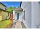 Charming home entrance featuring a covered porch and well-maintained landscaping at 6286 Manitoba Dr, Lakeland, FL 33805