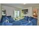 Spacious living room with a large sectional sofa and sliding glass doors leading to the backyard at 6286 Manitoba Dr, Lakeland, FL 33805