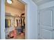 Walk-in closet with abundant storage space, and shelving for easy organization at 6286 Manitoba Dr, Lakeland, FL 33805