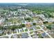 An aerial view of a residential area shows houses with mature trees and landscaping at 7968 Charleston Blvd, Lakeland, FL 33810
