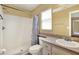 Bathroom with a shower and tub combination, a modern sink, and a vanity cabinet at 7968 Charleston Blvd, Lakeland, FL 33810