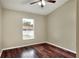 Bedroom featuring wood floors and a window at 7968 Charleston Blvd, Lakeland, FL 33810