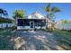 Charming backyard with well-maintained lawn and screened in porch at 811 W Heron Pl, Winter Haven, FL 33884