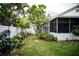 This backyard offers a blend of greenery and manicured beds, creating a private and peaceful outdoor space at 811 W Heron Pl, Winter Haven, FL 33884