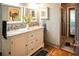 Bathroom featuring double sink vanity, mosaic tile backsplash, and walk-in shower at 811 W Heron Pl, Winter Haven, FL 33884