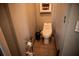 Cozy half-bathroom featuring a pedestal sink and neutral tones, maximizing a small space at 811 W Heron Pl, Winter Haven, FL 33884