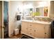 Bright bathroom featuring a double vanity with framed mirrors and decorative tile backsplash at 811 W Heron Pl, Winter Haven, FL 33884