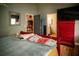 Bedroom with gray walls, red furniture and a bed covered by a quilt at 811 W Heron Pl, Winter Haven, FL 33884