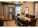 Dining area adjacent to kitchen with large stainless steel refrigerator and view of stained glass window at 811 W Heron Pl, Winter Haven, FL 33884