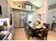 Bright dining area featuring stainless steel appliances and natural lighting from the windows at 811 W Heron Pl, Winter Haven, FL 33884
