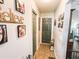 Hallway with multiple doors and Gathering photos on the wall at 811 W Heron Pl, Winter Haven, FL 33884