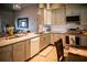 Modern kitchen with an island, stainless steel appliances, light gray cabinetry, and tile flooring at 811 W Heron Pl, Winter Haven, FL 33884