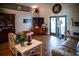 Inviting living room with hardwood floors, fireplace, and entertainment center for a cozy atmosphere at 811 W Heron Pl, Winter Haven, FL 33884