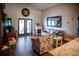 Bright living room with vaulted ceilings, fireplace, and french doors offering a welcoming space for relaxation at 811 W Heron Pl, Winter Haven, FL 33884