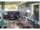Inviting screened patio features a hot tub and stylish seating area, perfect for relaxation and outdoor living at 811 W Heron Pl, Winter Haven, FL 33884