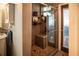 Modern bathroom featuring a tiled shower with built-in seat and storage shelves at 811 W Heron Pl, Winter Haven, FL 33884