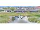 Aerial view of backyard with screened pool, private dock and lake access at 1342 Heritage Landings Dr, Lakeland, FL 33805