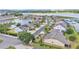 Stunning aerial view of a lakeside community featuring well-maintained homes, mature landscaping and beautiful waterfront views at 1342 Heritage Landings Dr, Lakeland, FL 33805