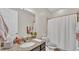 Bathroom featuring granite countertop and bath with shower at 1342 Heritage Landings Dr, Lakeland, FL 33805
