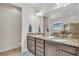 Bathroom features double vanity with granite countertops and neutral wall color at 1342 Heritage Landings Dr, Lakeland, FL 33805