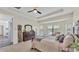 Bright bedroom with a tray ceiling, plush carpets, and a serene view at 1342 Heritage Landings Dr, Lakeland, FL 33805